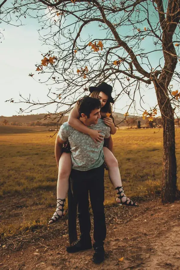 A couple sitting together outdoors, representing emotional closeness in a relationship